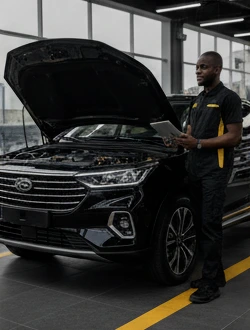 Techinician inspecting a vehicle